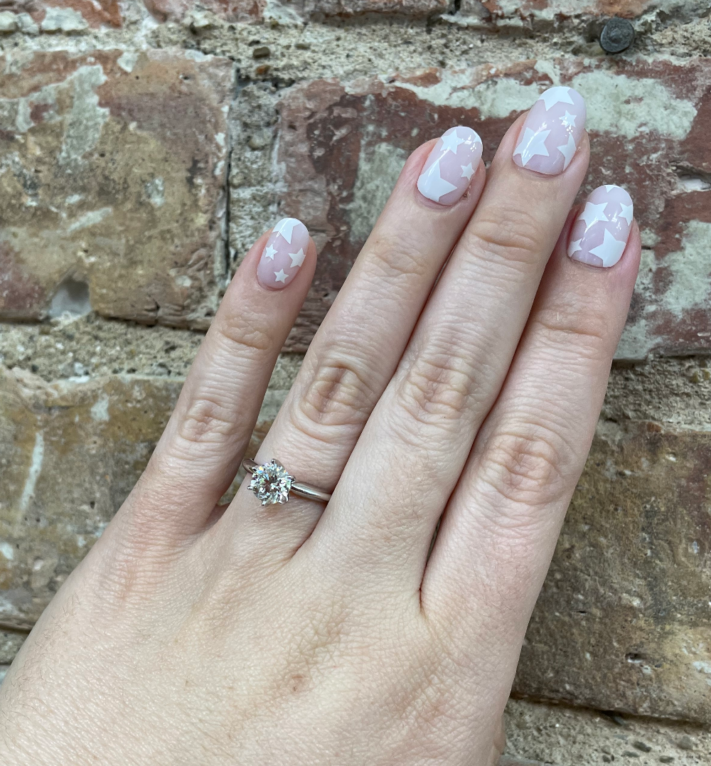 14K White Gold 1.12CT Round Solitaire Diamond Engagement Ring on hand