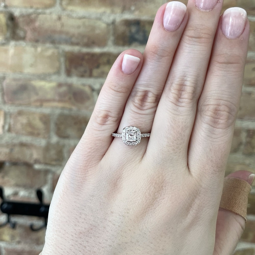 14kw halo style engagement ring on model