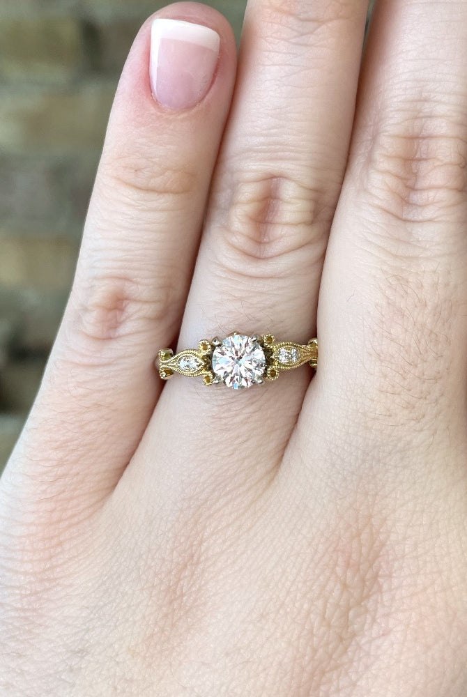 view of 14k two toned engagement ring on model