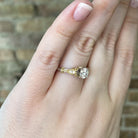 view of side details of 14k two toned engagement ring