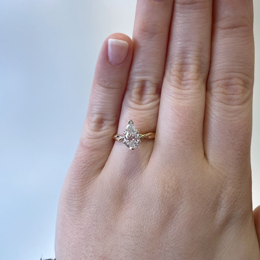 14ky pear cut diamond solitaire engagement ring on model