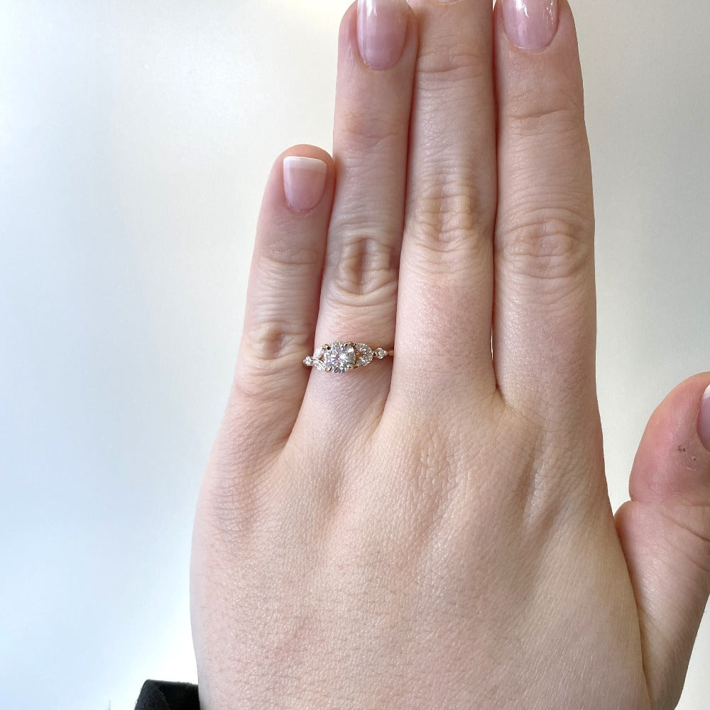 14ky round and marquise diamond engagement ring on model