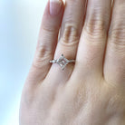 14kw Princess cut diamond engagement ring with marquise and baguette accents on model