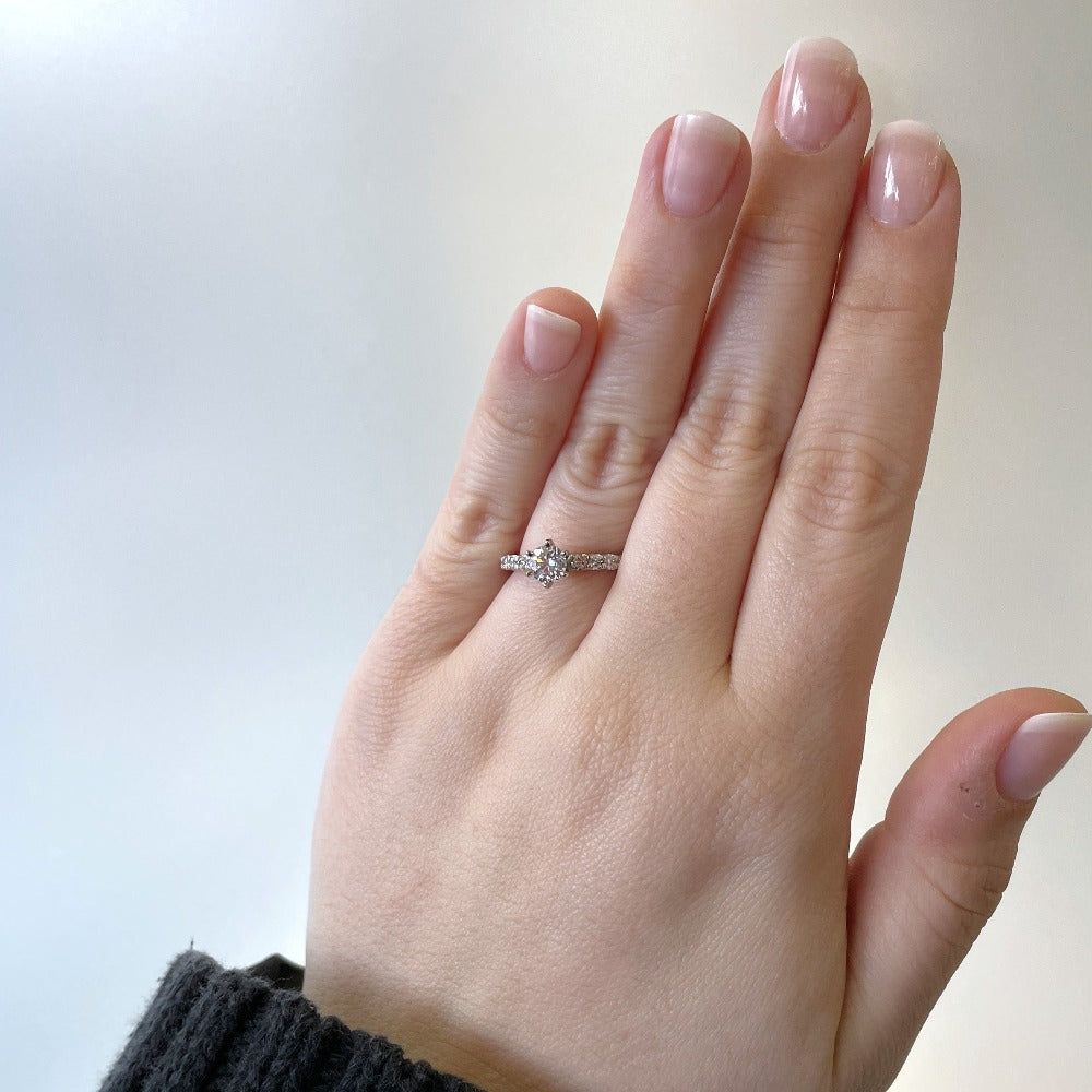 14kw accented solitaire engagement ring on model