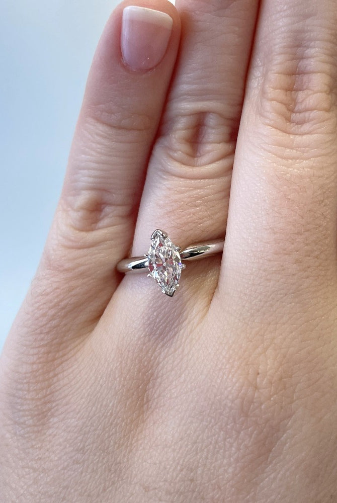closer view of 14kw 1ct marquise cut diamond engagement ring on model