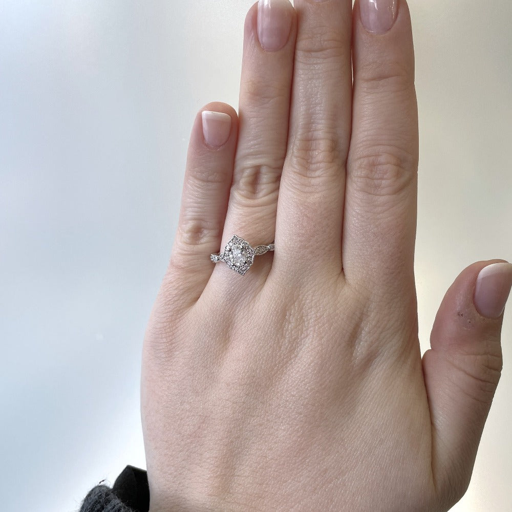 14kw oval halo style vintage inspired engagement ring on model