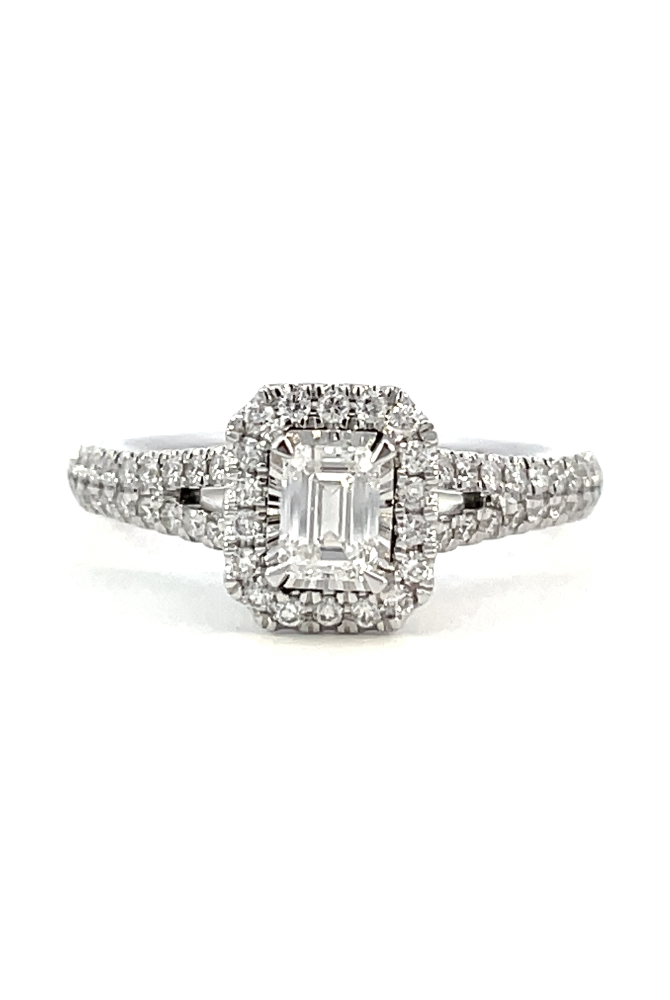 front view of 14kw emerald cut halo style engagement ring with split shank