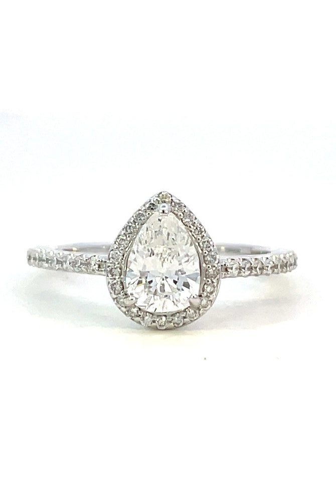 front view of 14kw halo style engagement ring with pear cut center.