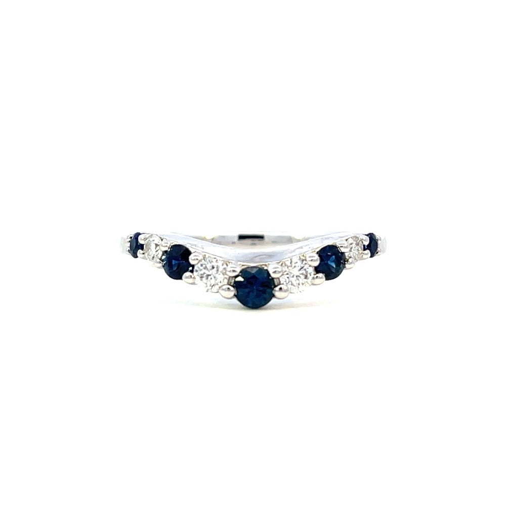 front view of 14kw curved wedding band with diamonds and sapphires.
