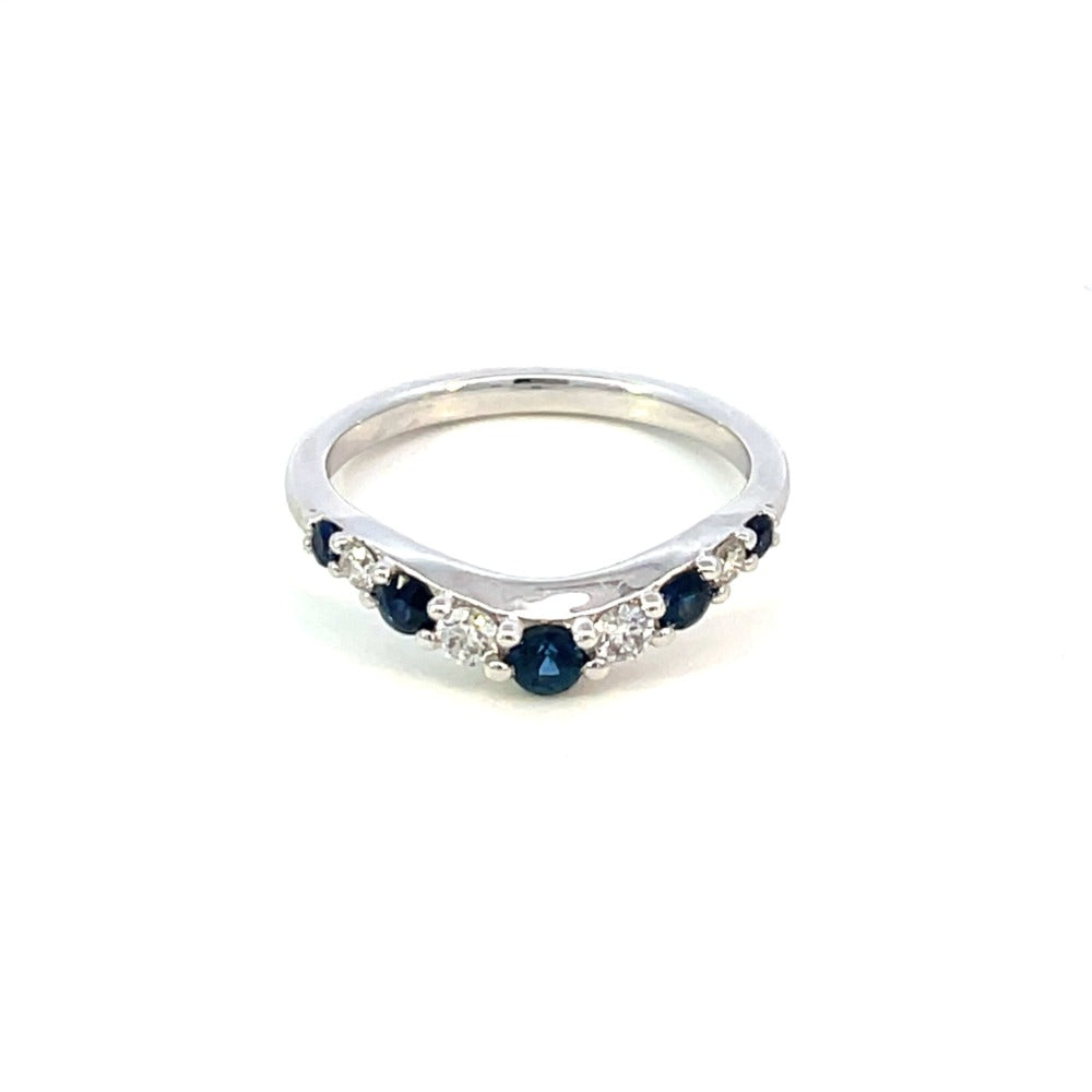 top view of 14k white gold curved wedding band with diamonds and sapphires.