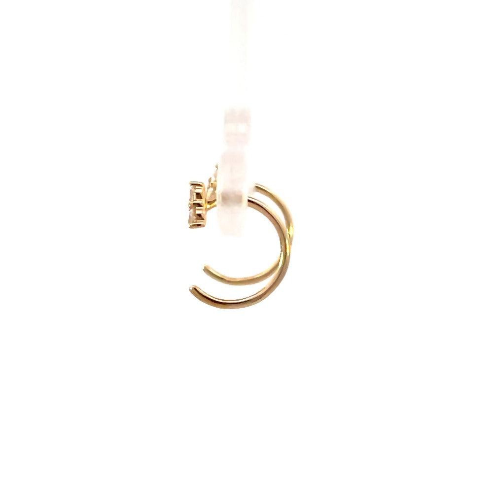 side profile view of 14ky tri-diamond huggle hoop earrings.