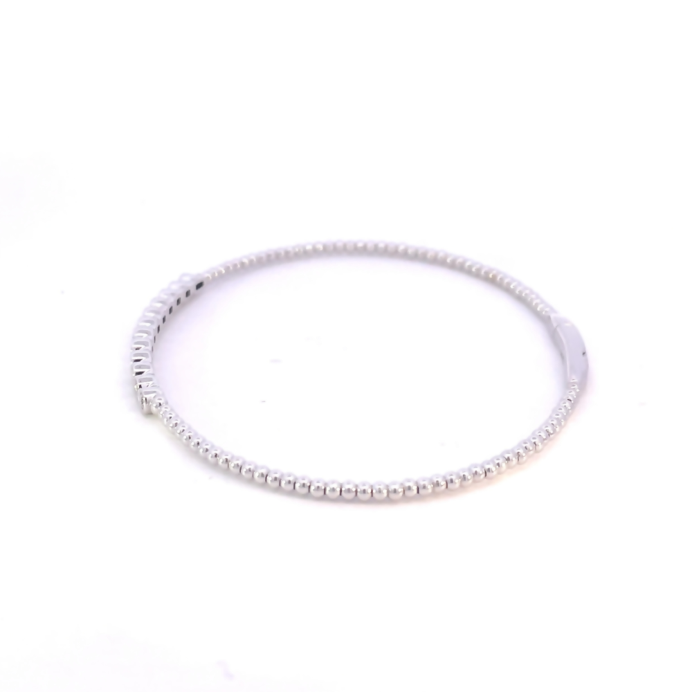 side view of beaded bangle w bezel set diamonds