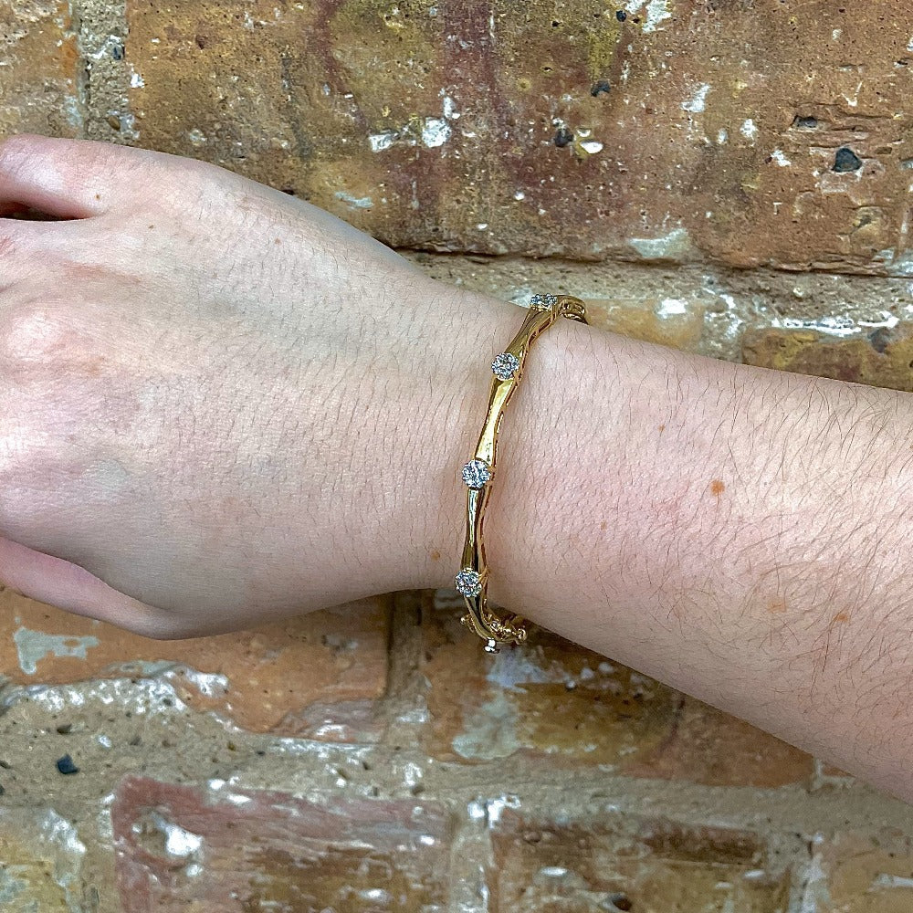 yellow gold bracelet on the wrist