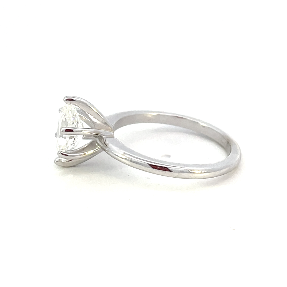 side profile view of 14kw 1.51. carat oval cut diamond solitaire engagement ring.