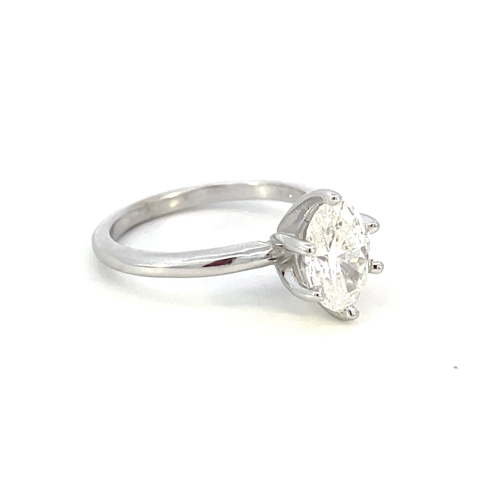 side view of 14kw 1.51ct oval cut diamond solitaire engagement ring.