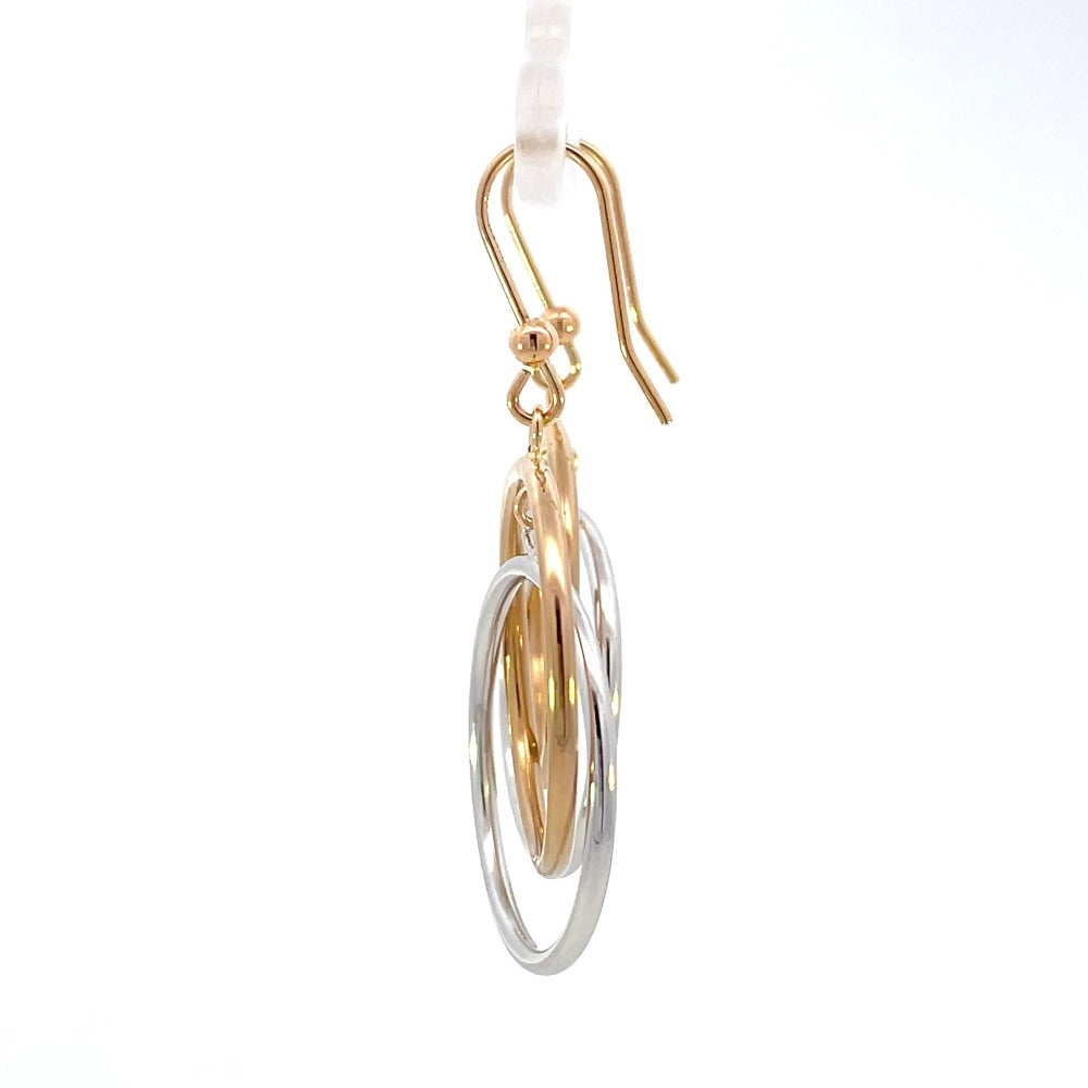 side view of 14k two-toned gold circle drop earrings with french wires