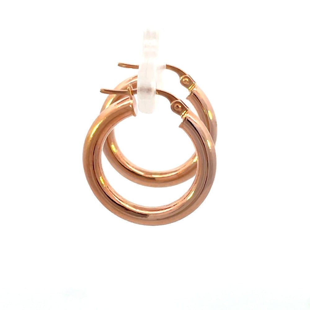 side view of 15mm 14k rose gold tube hoop earrings. Picture shows size of hoop as well as closure.