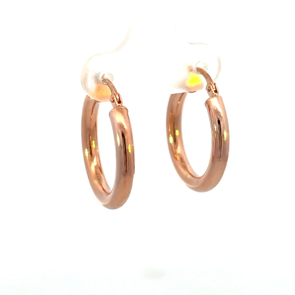 front view of 15mm 14k rose gold tube hoop earrings. Picture shows thickness of metal.