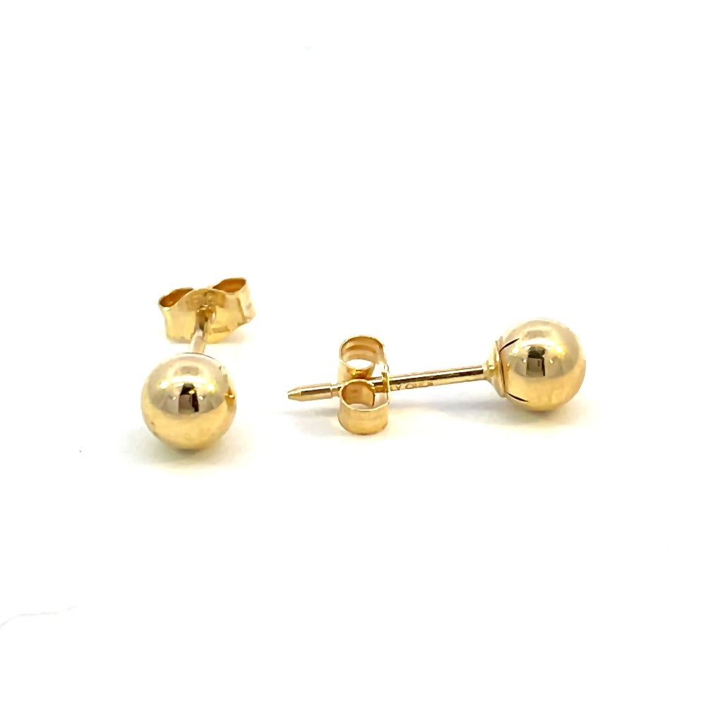 side view of 5mm gold ball earrings that shows the posts and backs.