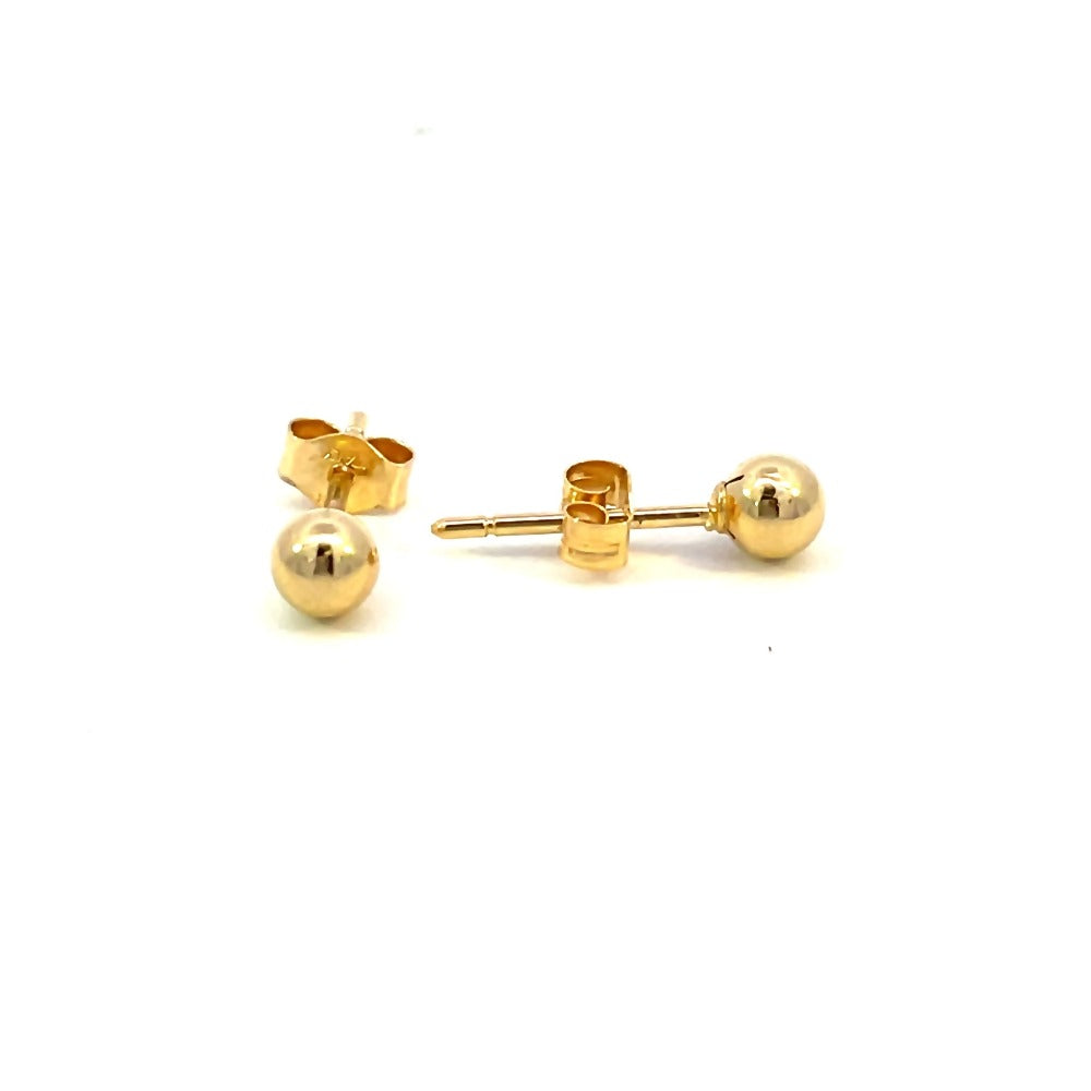 side view of 4mm gold ball earrings. picture shows earring backings.