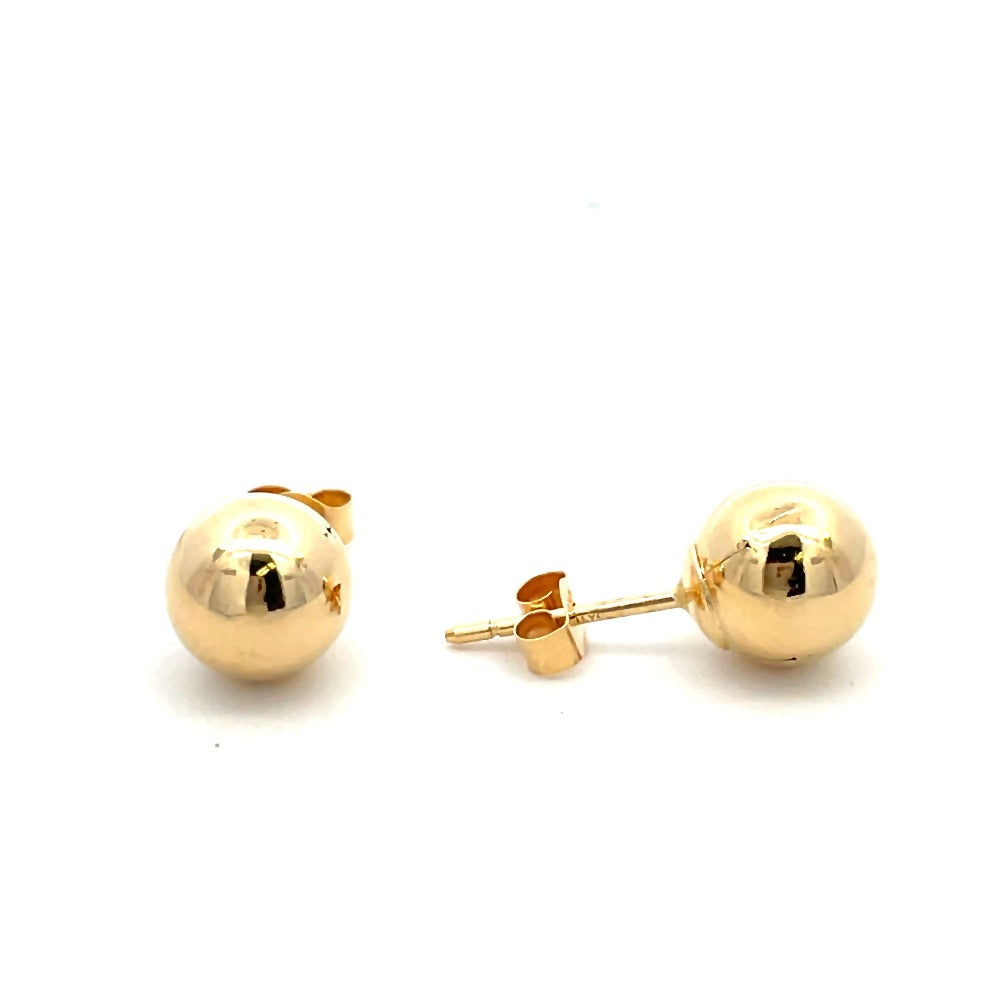 side view of 8mm gold ball earrings. picture shows earring backs.