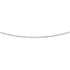 detail view of 14k white gold anklet showing the pattern of 3 flat stations and 5 diamond cut barrel links.