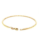 back view of 14ky gold bead cuff bracelet with diamond cutting on the beads. picture shows the lobster clasp and karat stamps