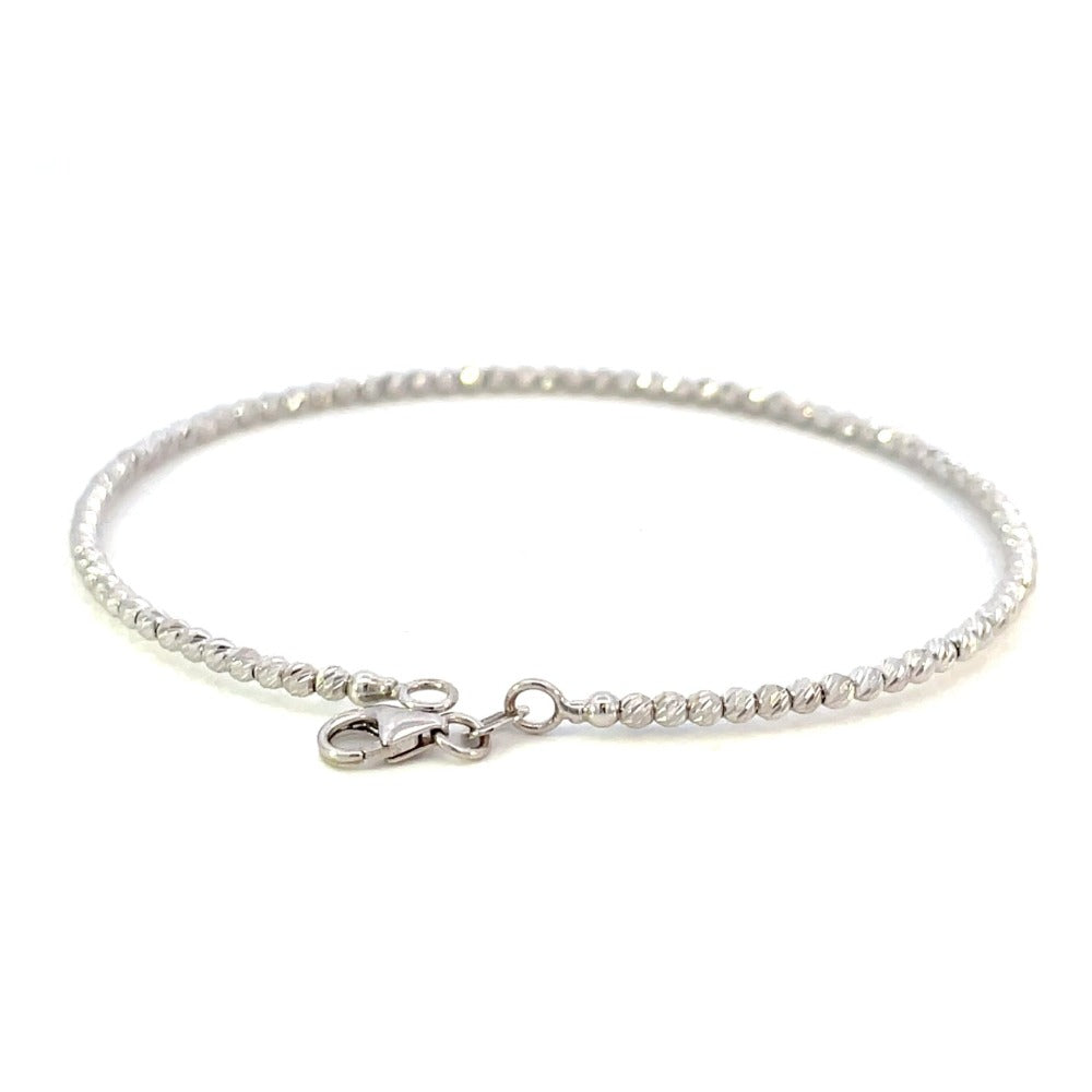 back view of 14k white gold beaded bracelet with diamond cutting on the beads and a lobster clasp