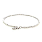 back view of 14k white gold beaded bracelet with diamond cutting on the beads and a lobster clasp