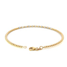 back view of 14k two toned gold beaded bracelet showing the high polish yellow gold beads and lobster clasp