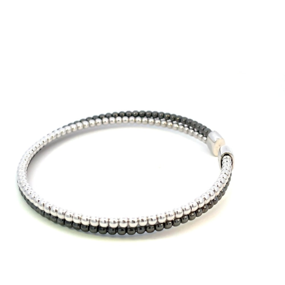 side view of two row black and white beaded bangle in sterling silver