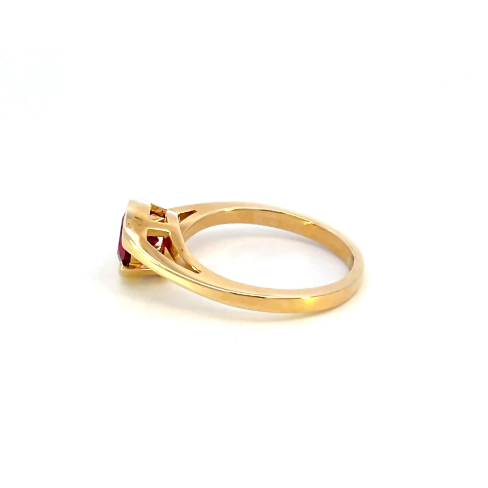 side view of 14 karat yellow gold created ruby ring
