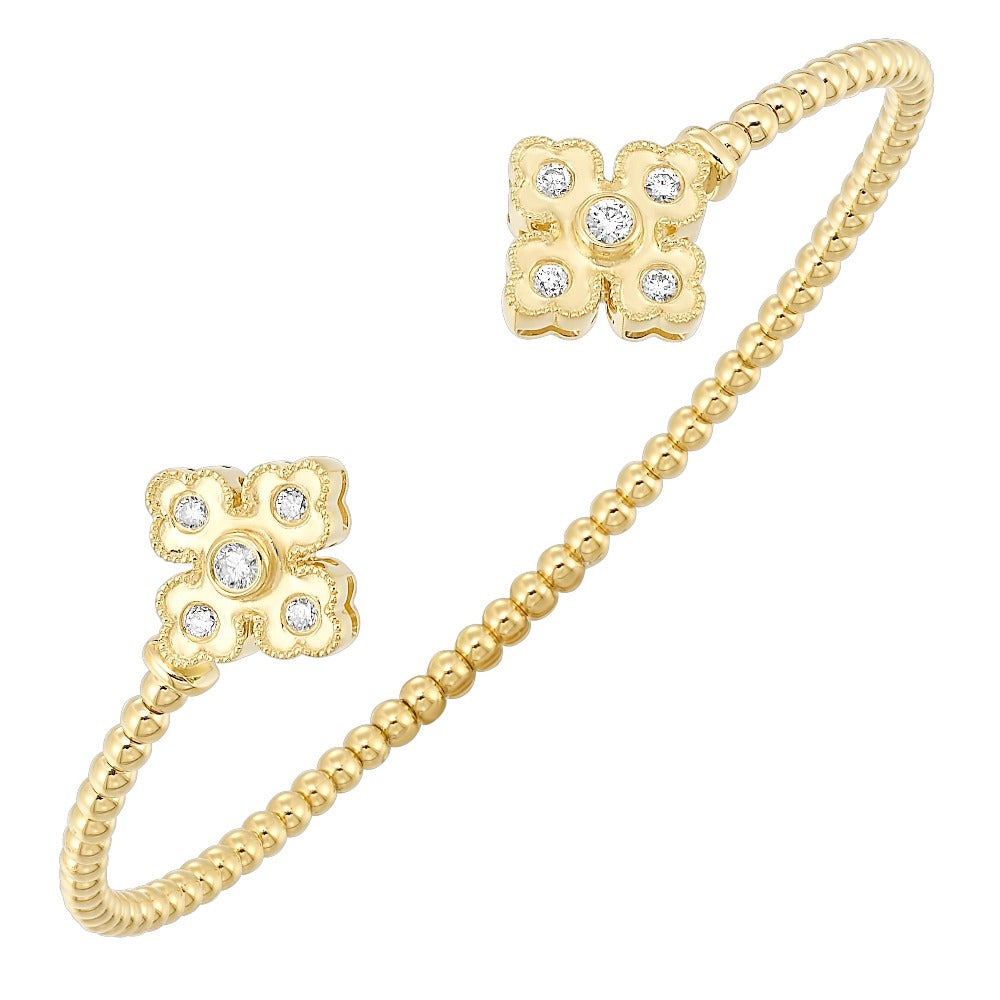 detail view of 14ky floral inspired open bangle bracelet.