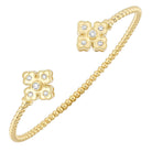 detail view of 14ky floral inspired open bangle bracelet.