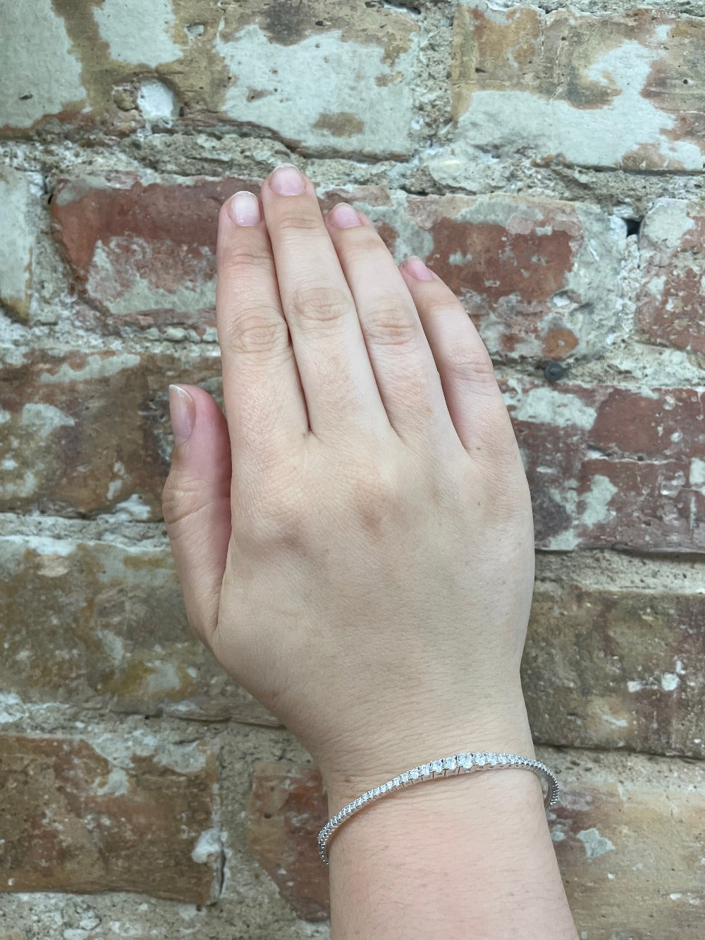 Sterling Silver Platinum Finish Flexible Bracelet with Graduated CZ Stones on wrist