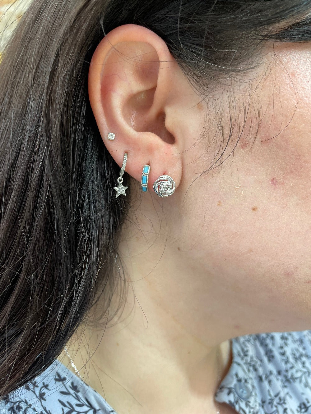 Sterling Silver Double Love Knot Earrings being worn