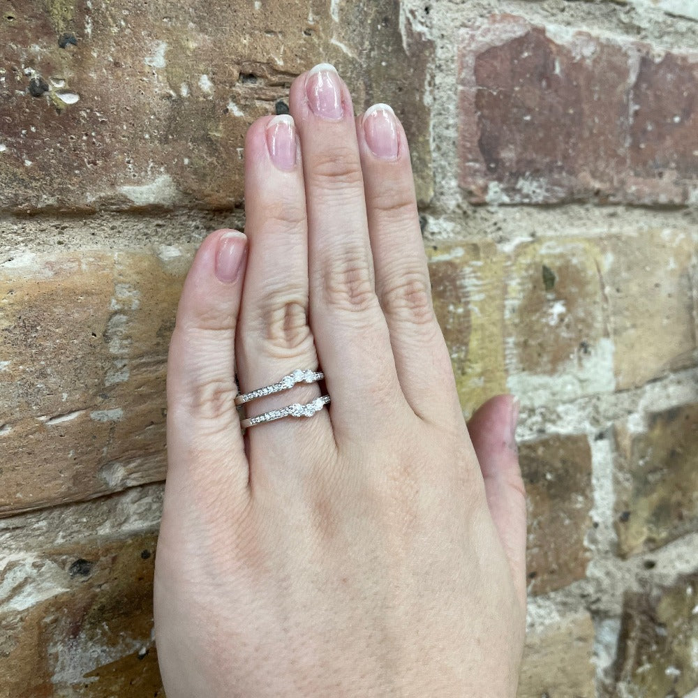 14KW Gold Three Diamond Wedding Guard 5/8CTW on model