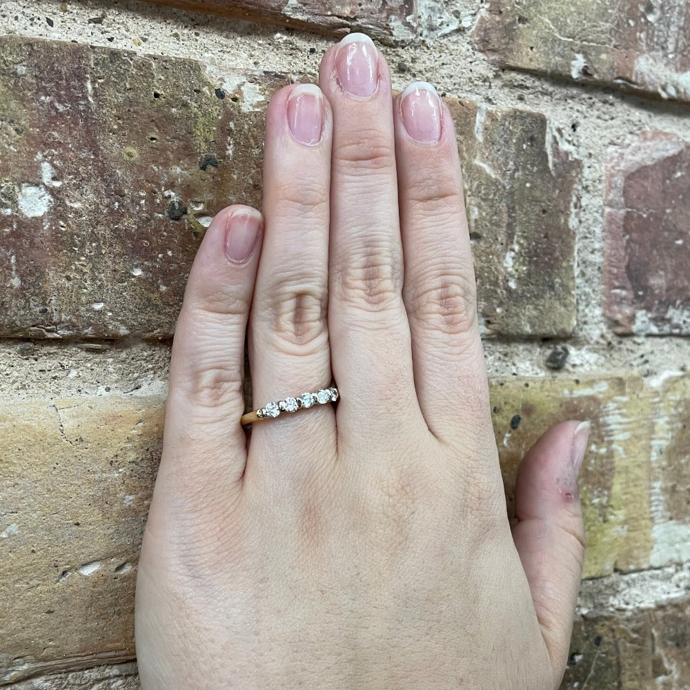 14K Two Tone Diamond Wedding Band on model hand