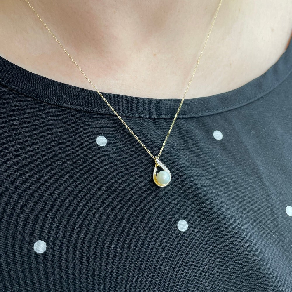 14KY Tear Drop Shaped Pearl Pendant 1/50 CTW on model