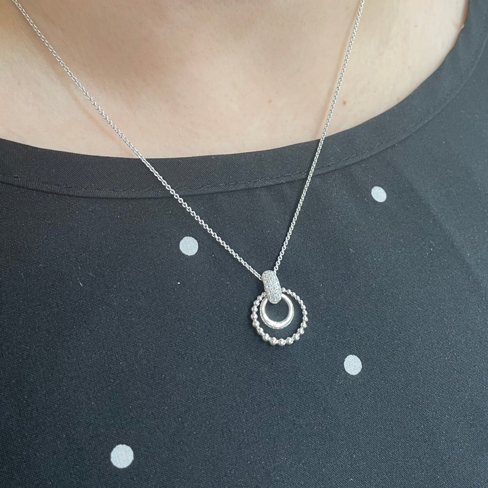 Sterling Silver Double Circle Pendant with Diamond Bail on model