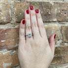 1.51 CTW Emerald Cut Lab Grown Diamond Engagement Ring with Halo on model