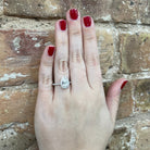 1.56 CTW Pear Cut Lab Grown Diamond Engagement Ring with Halo on model