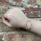 14K Two-Toned Oval Shaped Diamond Bangle 1 CTW on model