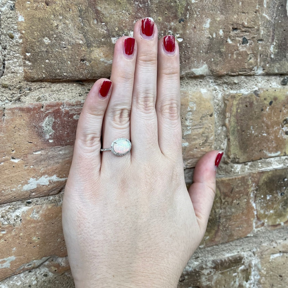 14KW Oval Opal with Diamond Halo .25 CTW Diamonds on model