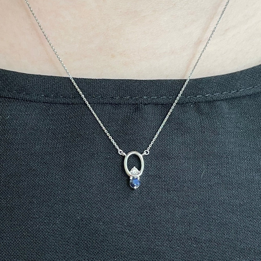 14KW Oval Shaped Pendant with Blue Sapphire and Diamond on model