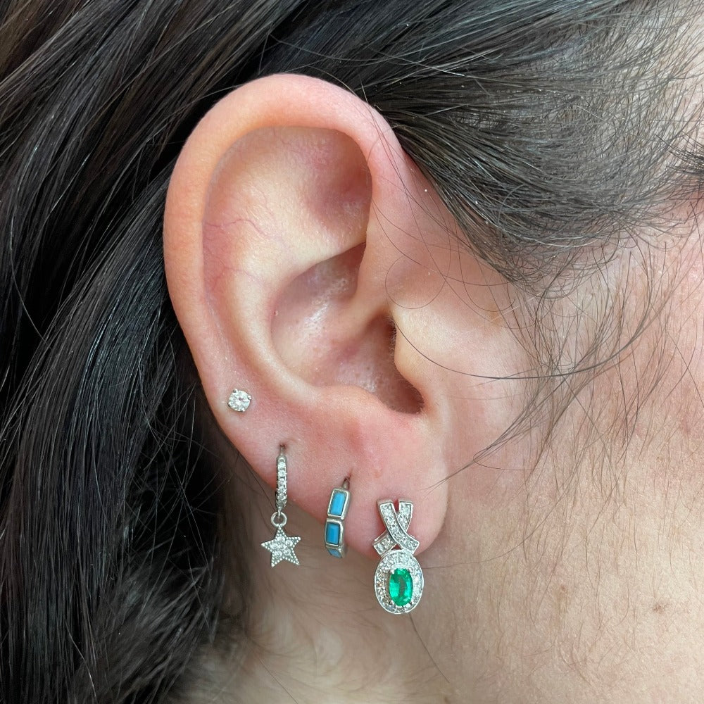 10KW Oval Lab Grown Emerald and Diamond Earrings 1/4 CTW on model