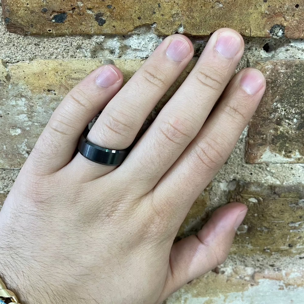 Men's 8mm Black Ceramic Wedding Band with Bevel Edge and Satin Finish on hand