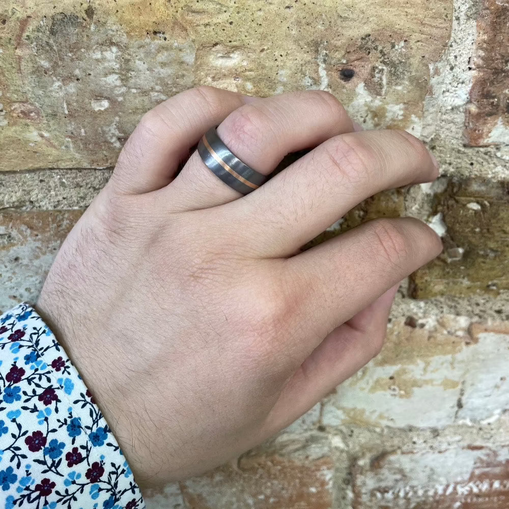 Men's 8mm Tantalum Dome Ring with 14K Rose Gold Inlay on hand