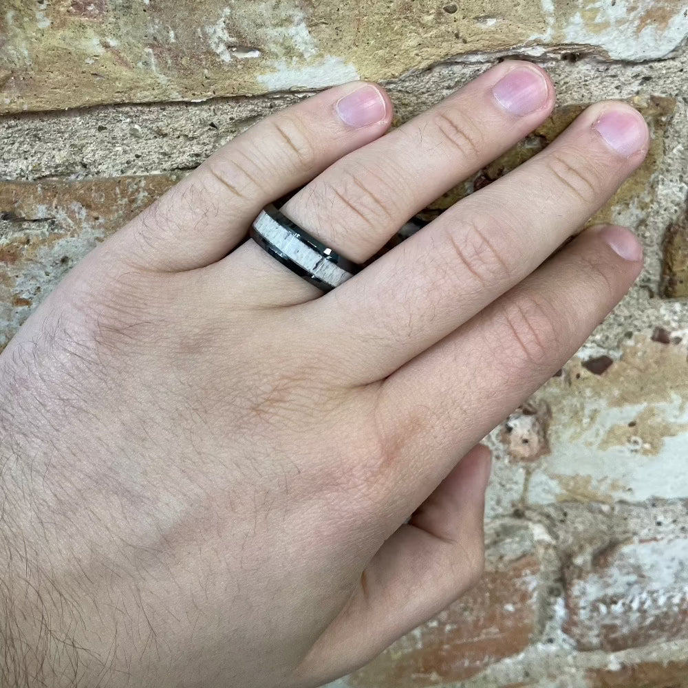 Men's 8mm Black Ceramic Band with Antler Inlay on hand