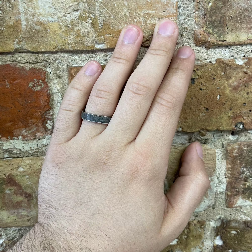 Men's 5mm Cobalt Band with Meteorite Inlay on hand